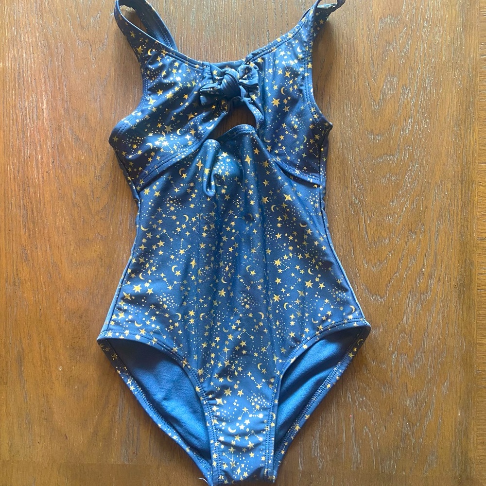 2/$10, 3/$12 Like new girls 1-piece swimsuit, blue with gold stars, cutout sides